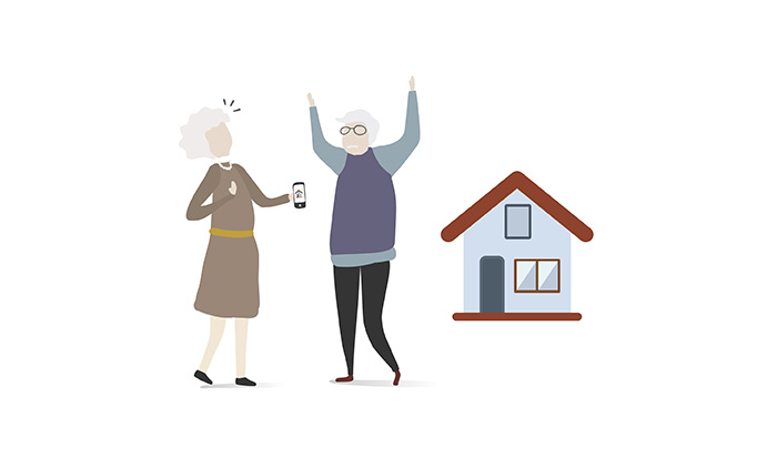 older people celebrating next to a house